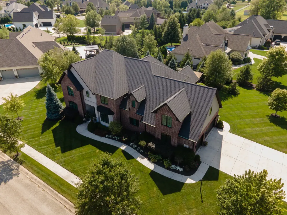 Architectural shingles with ridge vent before restoration in Viking Meadows, Nora, IN