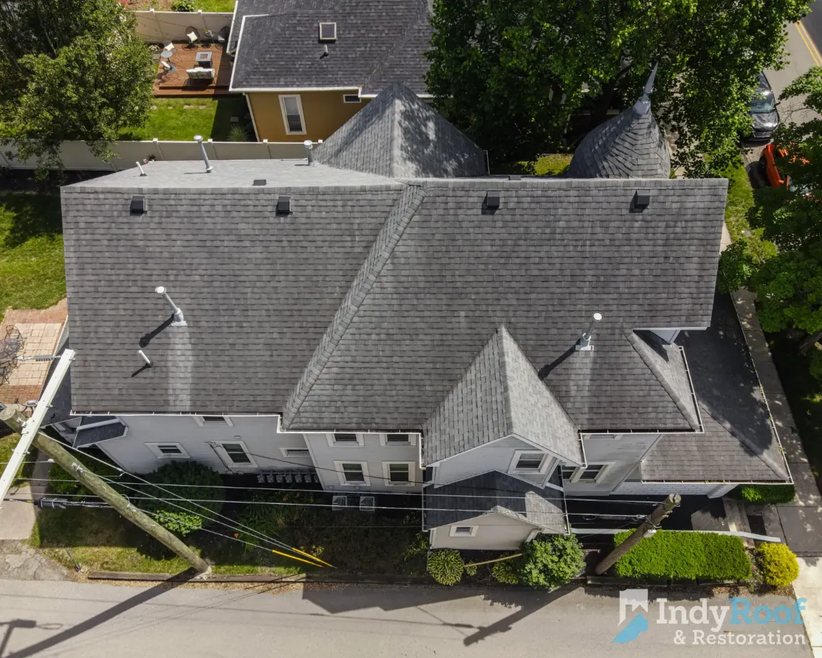 Architectural shingles with ridge vent before restoration in Chatham Hills, Nora, IN